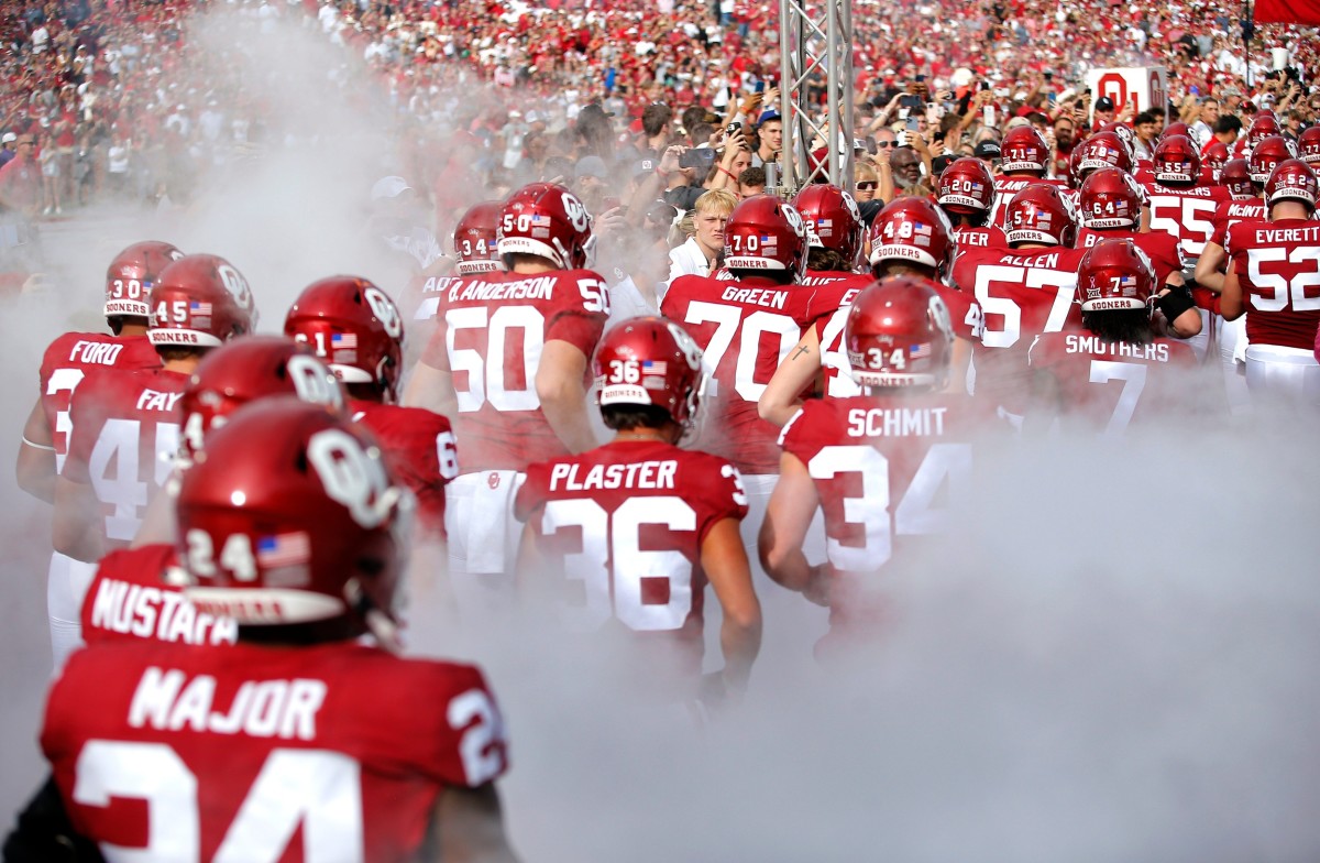 Oklahoma runs on to the field before the college football game between the University of Oklahoma Sooners and the University of Central Florida Knights at Gaylord Family Oklahoma-Memorial Stadium in Norman, Okla., Saturday, Oct., 21, 2023.